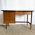 A striking piece from the celebrated Mainline by Hooker collection, this Mid Century Modern walnut writing desk blends...