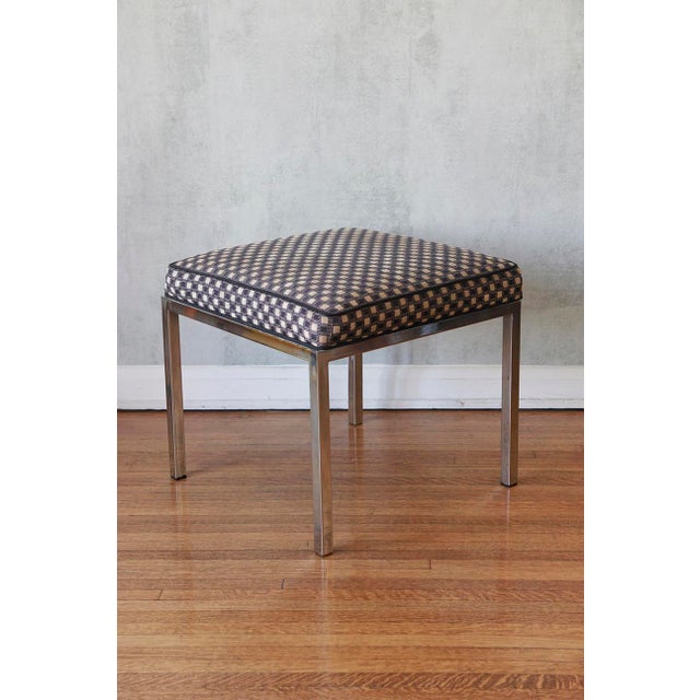 The sleek, geometric design of this stool exemplifies the precise, rational approach to craftsmanship that Mies van der...