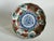 An antique Japanese Imari porcelain bowl from the Meiji period (1868–1912), featuring underglaze cobalt blue with...