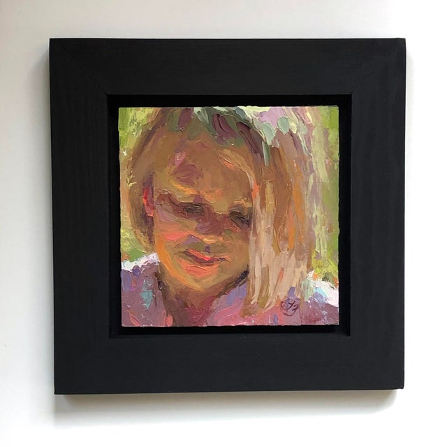 This intimate oil painting captures a serene moment, focusing on a figure with soft, blended colors that evoke warmth and...