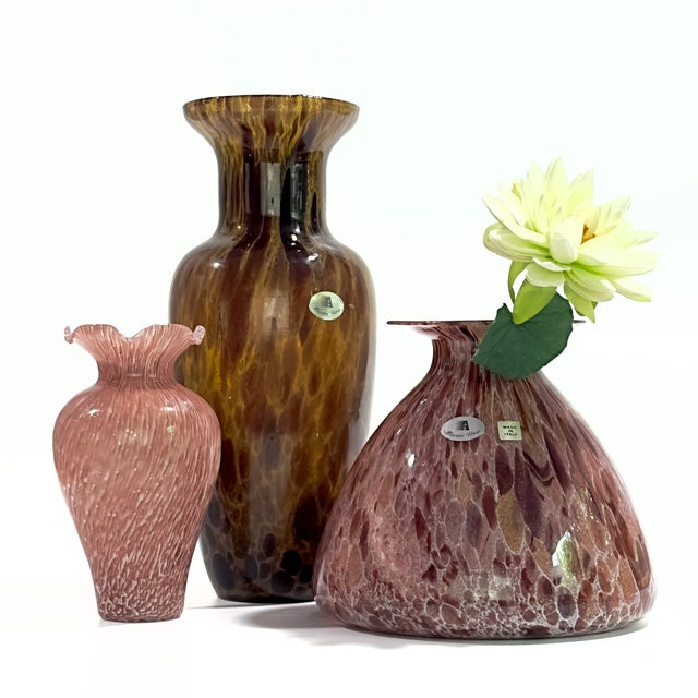 This collection features three exquisite vintage Italian hand-blown art glass vases, primarily crafted by the renowned...