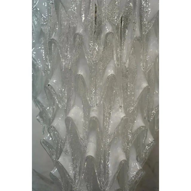 Extraordinary transparent white and color for this Murano chandelier, a strong white color with a unique transparency. Its...