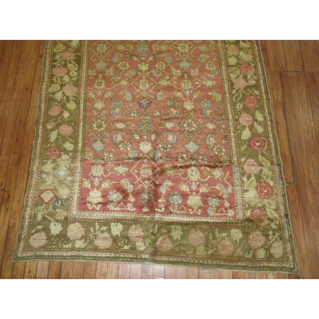 Plush pile Karabagh rug with an all-over Herati and floral design on a salmon colored field and a floral border in soft...