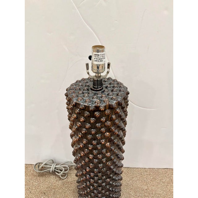 Stylish Arteriors Lamp. Large Cylinder shape with shell points. Bronze glaze. Showroom floor sample.