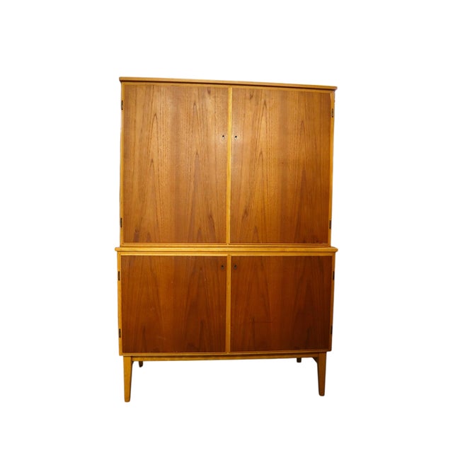 With its spacious interior and striking mid-century design, this gorgeous double bodied cabinet is an eye-catching and...