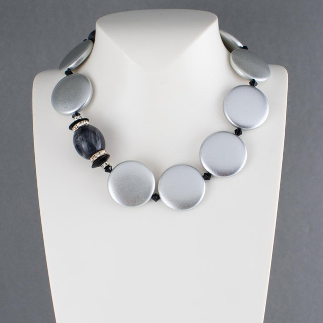 Handcrafted in Italy, this beautiful Angela Caputi resin necklace features a pearlized silver tone with black contrast....