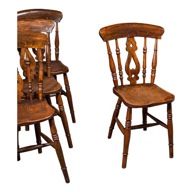 This is a delightful set of 4 antique station chairs. An English, beech and elm country kitchen seat, dating to the...