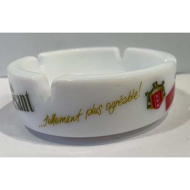 Great graphics on this vintage Peter Stuyvesant milk glass ashtray. Great catchall or bar addition!