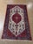 Hand-knotted Persian Zanjan rug with a central red medallion set on an ivory field, featuring a stylized Tree of Life...