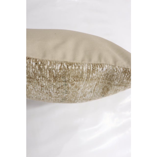 a Neutral Color Persian Antique Rug pillow