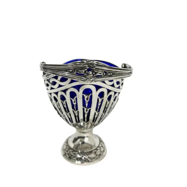 German silver basket with blue glass by Storck & Sinsheimer An early 20th Century silver 800/1000 basket with movable...