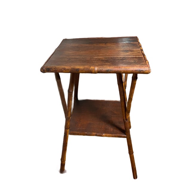 Beautiful vintage Edwardian bamboo side table. Solid oak top with bottom shelf.