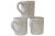 Set of three large vintage pottery mugs in white with incised fish, fruit and flowers. Marked underside. Light wear with...