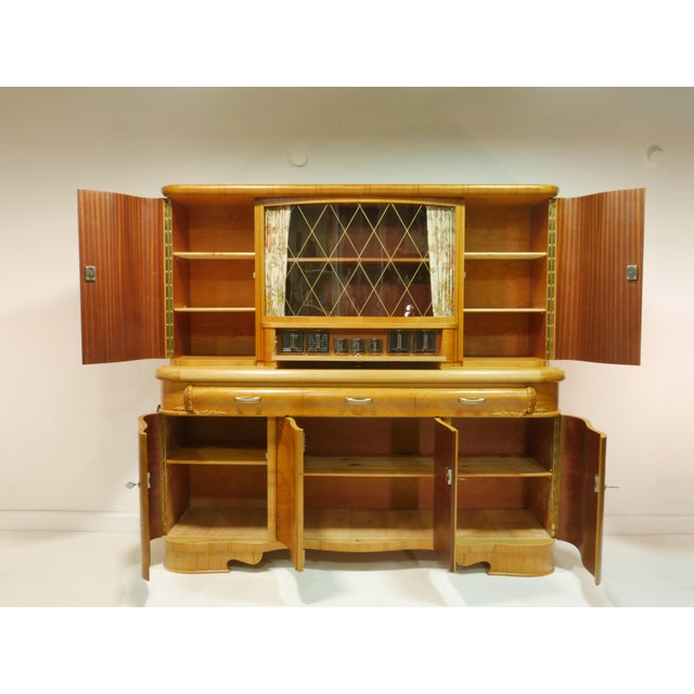 This vintage kitchen cabinet is an original piece of furniture from the 1960s and consists of two sections. The frame is...