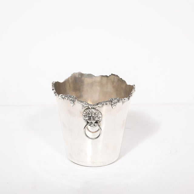 Embrace the grandeur of a bygone era with this exquisite Neoclassical Sterling Silver Ice Bucket, crafted by the...
