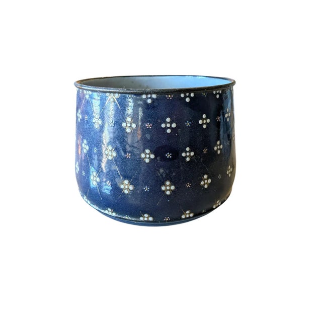 Pair of vintage enamel planters, perfect for adding a touch of rustic charm to any indoor or outdoor space. Holes in...