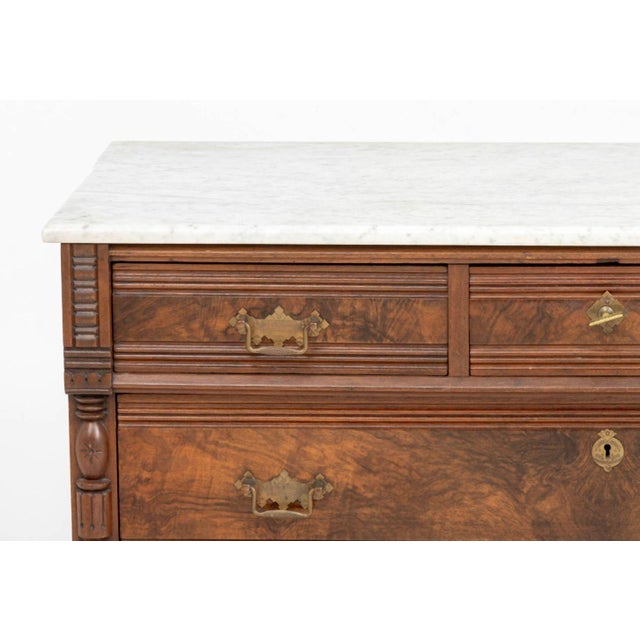 American Victorian Marble Top and Walnut Chest of Drawers, the gray marble top above three short drawers and two long...