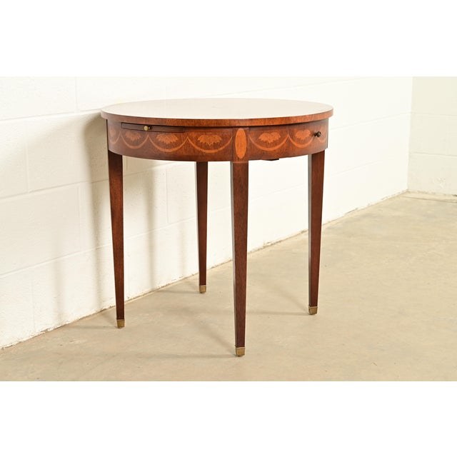 A gorgeous Federal or Hepplewhite style tea table or occasional side table By Baker Furniture USA, Late 20th Century...