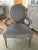 Inspired by the Louis XVI style, this updated version features a gold and silver carved frame with light grey upholstery....