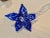 Beautiful blown glass art of a flower measuring 14.5” long and the span of the pedals are 5” . The stem is clear and the...