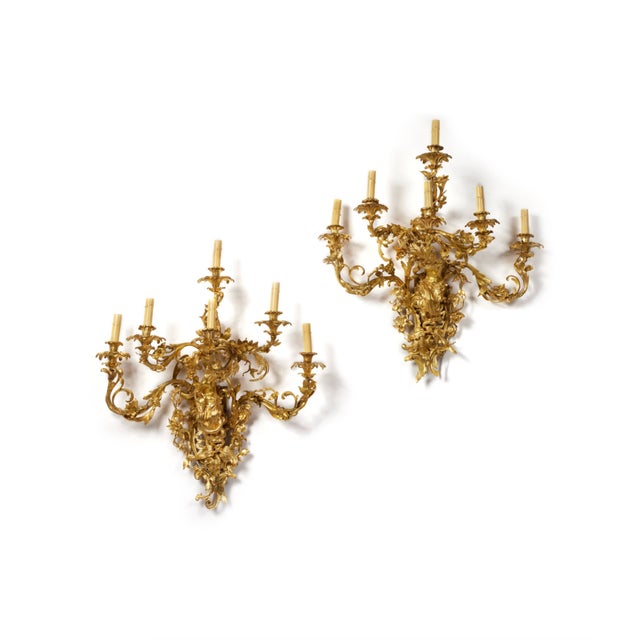 A Monumental Pair of Gilt Bronze Ormolu Six Light Wall Lights in the Manner of Francesco Ladatte An exceptional and...