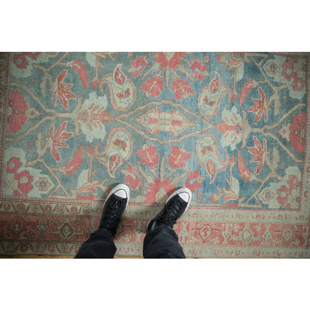 :: Minor elongated center medallion constituted of a floral top view atop a covered field of paisley botehs inwardly...