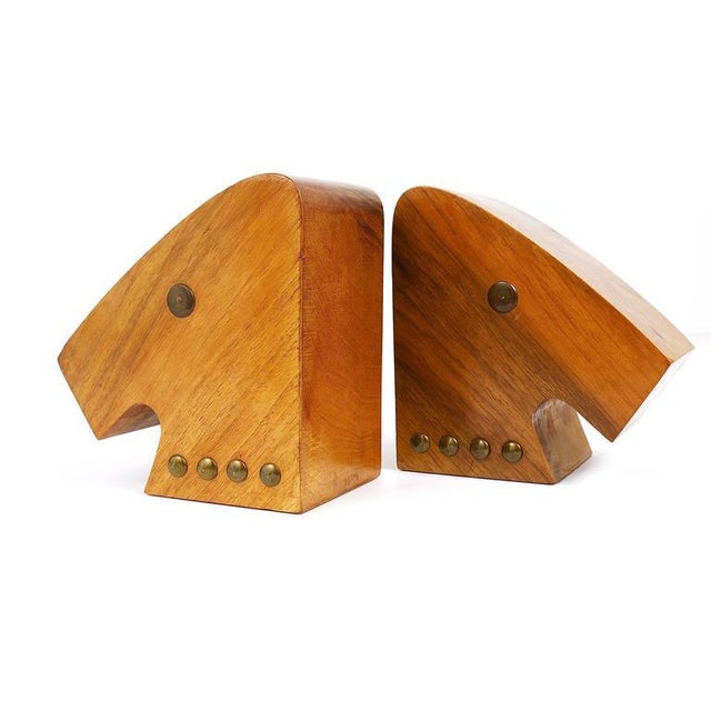 A pair of beautiful Mid-Century bookends, displaying horse heads, Austria, 1950s. Made of walnut and brass, in the style...
