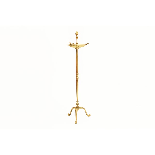 A striking vintage smoking accessory crafted in warm, richly toned gold brass, this elegant ashtray combines functionality...