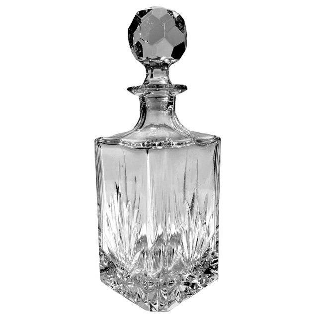 Elegant vintage square body cut lead crystal decanter with faceted ball stopper..Unmarked. Measures 10.25" high x 3.75"...