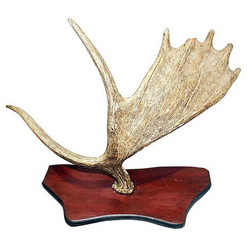 Decorative mounted moose antler on solid wood backing. Minor wear.