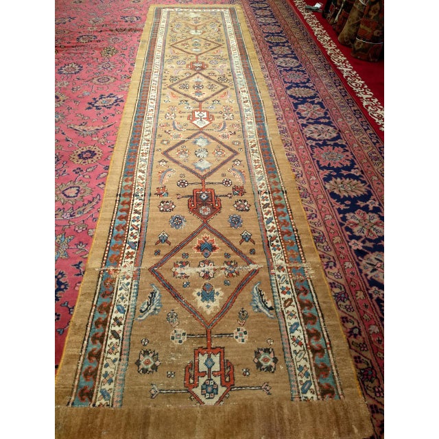 "This late 19th century Persian Serab camelhair runner is a companion piece to Serab Camelhair 1302 — similar in design,...