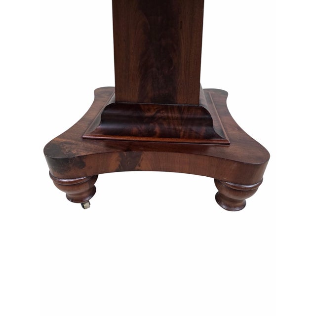 Antique American Empire Revival Figured Walnut Pedestal Game Table on Casters A handsome American Empire Revival game...