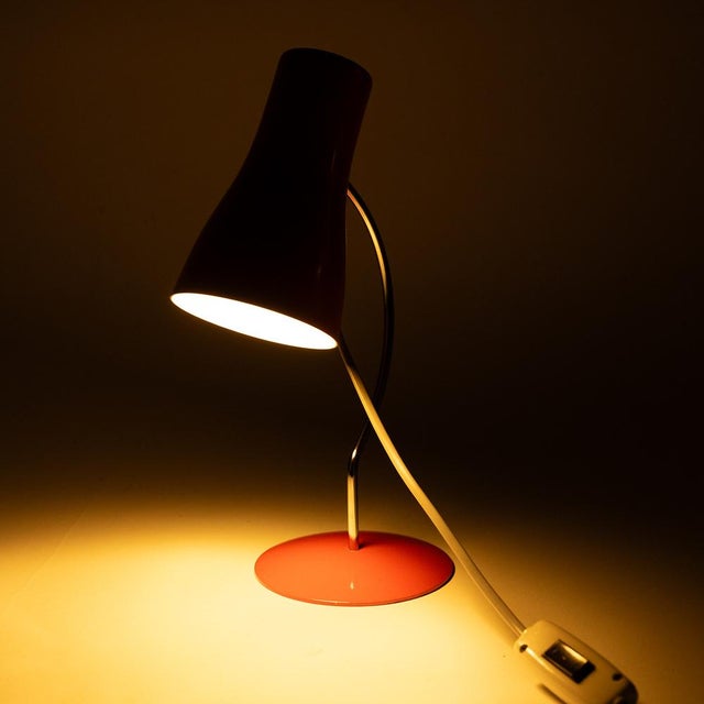 Small metal table lamp type 1633 from the 1960s in a rich red color. Its designer, Josef Hůrka, created several iconic...