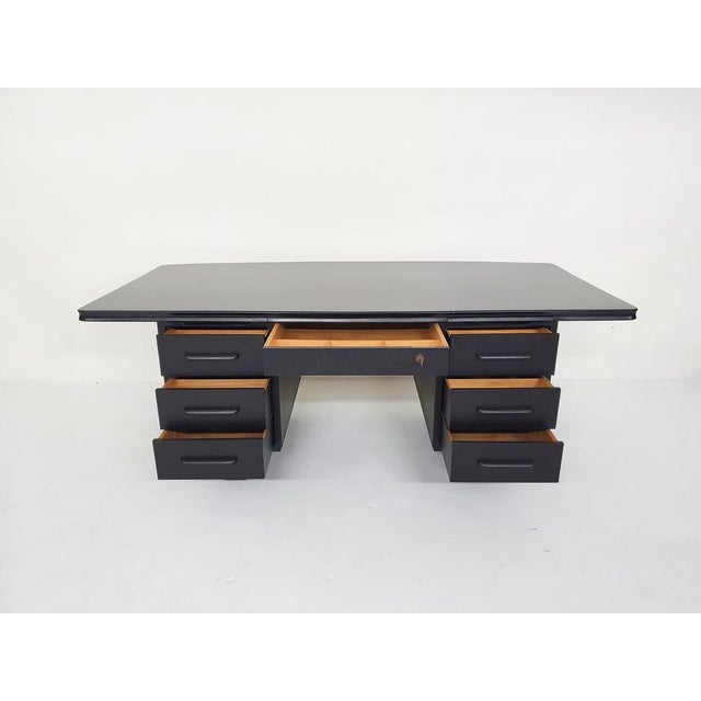 Large executive desk in black painted wood. In very good condition