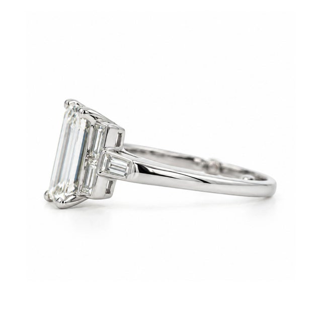Platinum Art Deco-style diamond ring centered by a GIA-certified 1.56-carat rectangular step cut natural diamond, graded K...