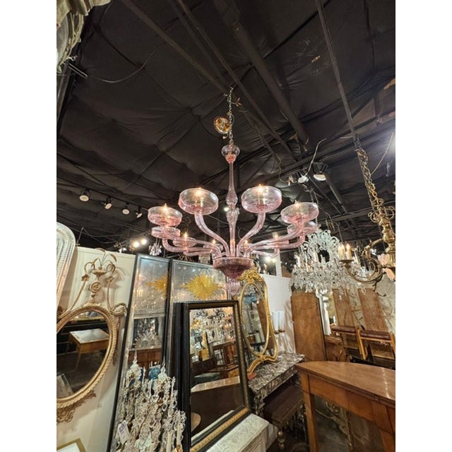The Murano Lavender Glass 10 Arm Chandelier is a stunning piece of home decor that adds a touch of elegance to any space....