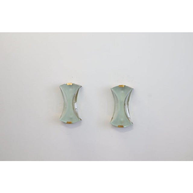 Max Ingrand for Fontana Arte: a rare pair of elegant modernist wall lamps, model 2225, with a frosted or etched central...