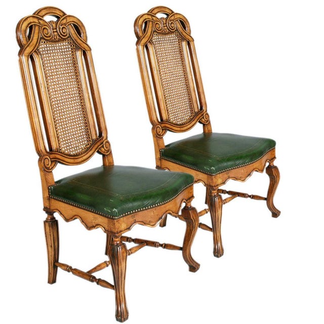 Eight sturdy Venetian Chippendale chairs, Palladian style, high back, in walnut entirely carved, Vienna straw, with green...