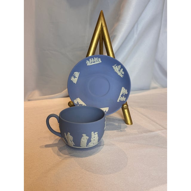 A beautiful teacup and saucer in the vintage Wedgwood Jasperware iconic pale blue and white colorway, dating to circa...