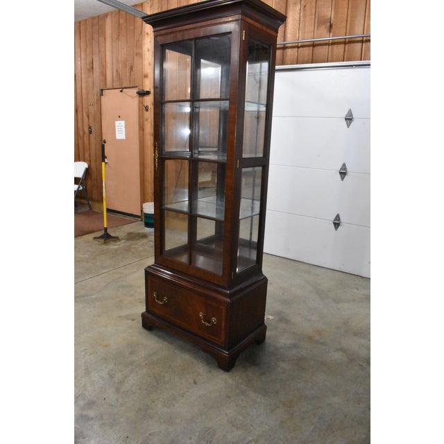 Gorgeous 1 piece Chippendale mahogany display cabinet made by Henkel Harris. Style 2301. The bottom section has 1 large...