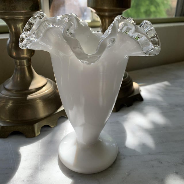 Here we have a very pretty vintage milk glass double crimped ruffled vase. It is unsigned, but attributed to Fenton. Made...