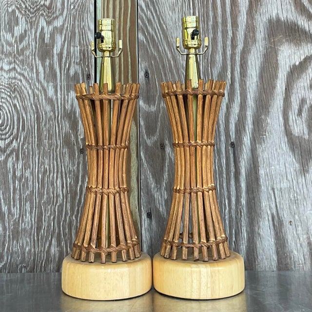 Bring coastal elegance to your home with this pair of vintage coastal pencil reed table lamps. Combining coastal vibes...