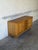 This low sideboard offers practical storage through a beautifully symmetrical layout. The long facade features four center...