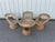Set of three armchairs and a table from the 1970s. One armchair seat is slightly worn and some of the wood fibers are...