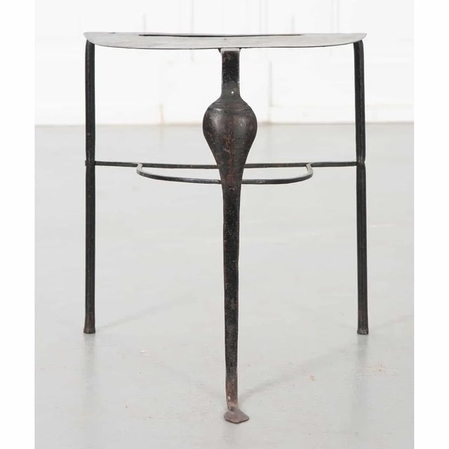 A small but lovely example of the blacksmith’s art, this hand-forged 19th century iron trivet from England features a flat...