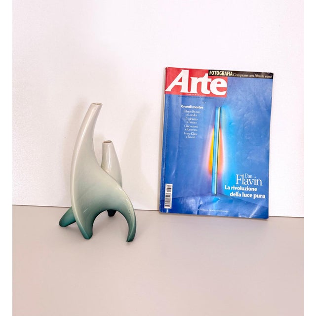 Made in Turin, Italy, 1950s. Made in white and green lacquered ceramic, which has been airbrushed. This flower vase is...