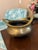A charming vintage brass censer or incense burner featuring traditional Asian-inspired styling with twin open handles,...