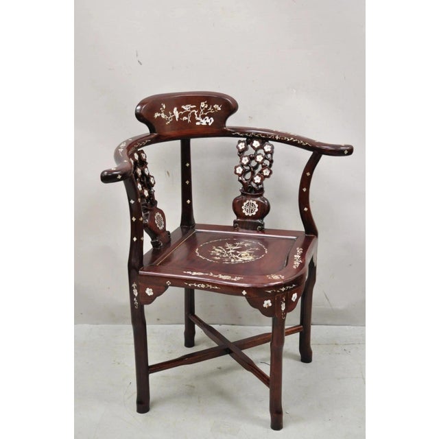 Vintage Chinese Carved Hardwood Corner Lounge Chair with Mother of Pearl Inlay. Item features impressive mother of pearl...