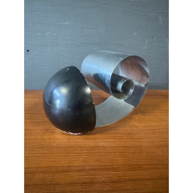 Art Deco Chrome Bookend by Reverse Rome n.y Marked on the bottom. Dimensions:7”w x 3.75”d x 4.75”h Condition:a few...
