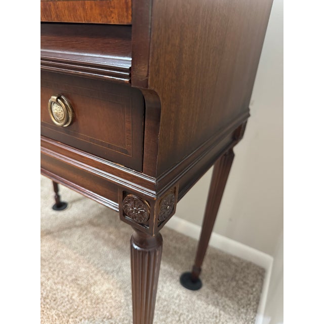 20th century reproduction cylinder desk with a curved, rotating wooden shutter that slides open to reveal an internal...
